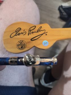 Elvis pen and wooden guitar case