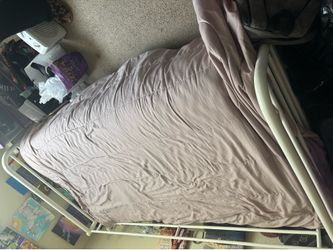White metal twin sized bed