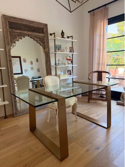 Glass work desk with gold accents
