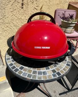 Red outdoor George Foreman dome electric grill