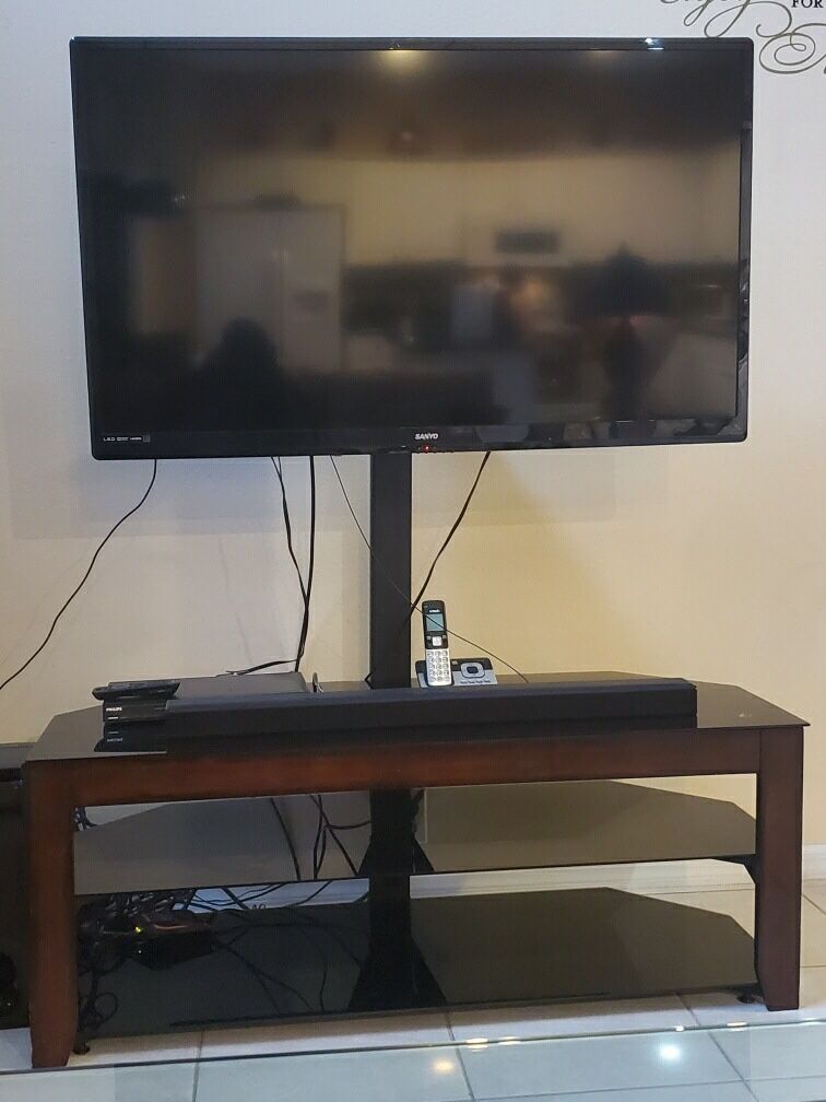 50” Sanyo Smart TV plus tinted glass and wood stand.