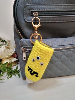 Amigurumi monster hand sanitizer holder. crochet hand sanitizer pouch. body lotion holder. bag charm. backpack hand sanitizer holder. gel disinfectant