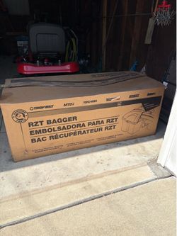 Riding lawn mower bagger attachment by Troy Built