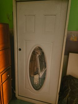 White Exterior Door with Oval Glass Insert