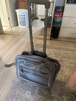 Delsey under seat rolling bag
