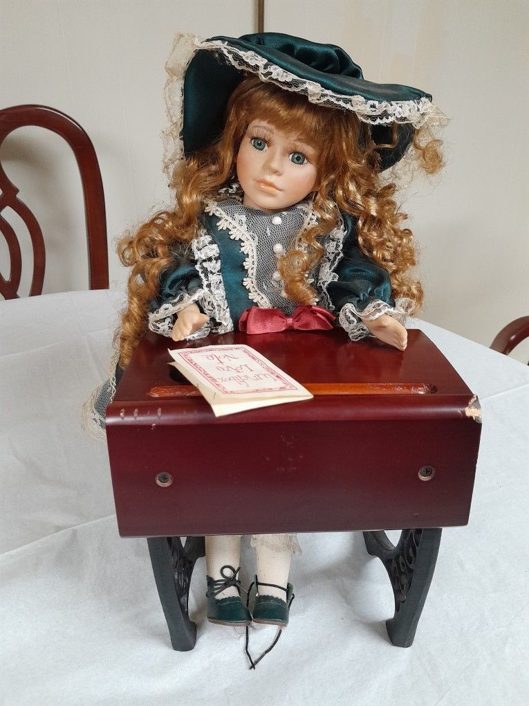Little School Girl At Her Desk