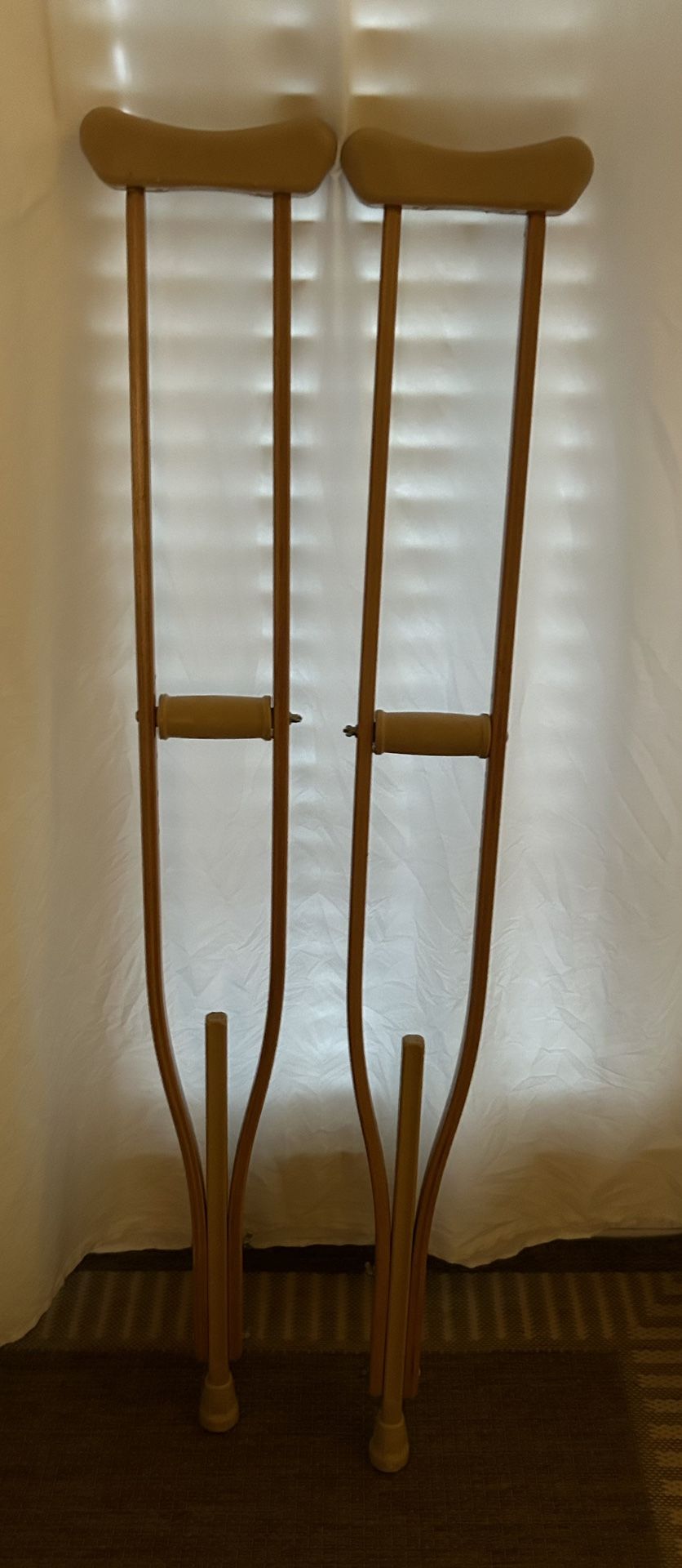 Wooden crutches: Adjustable From 5’ 10” to 6’ 6” tall.