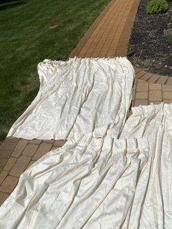 Cream colored pleated Curtains with valances and sheer scarves worth $1,000