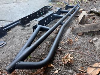 Cali raised rock sliders for Tacoma