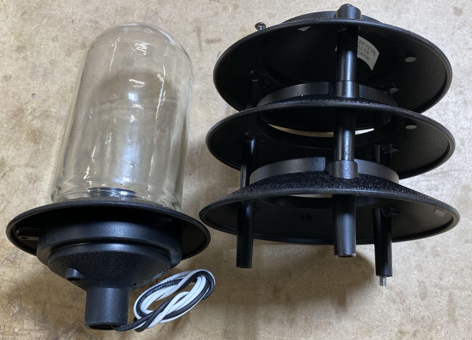 Landscape lights, pagoda style, black, metal-and-glass construction.