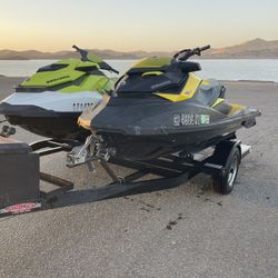 PAIR OF JET SKIS AND DOUBLE TRAILER 