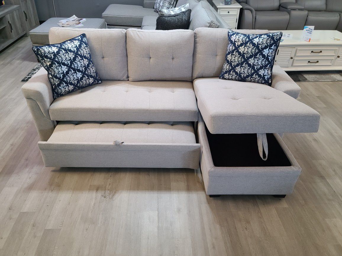 NEW GREY SECTIONAL SOFA WITH PULLOUT BED AND STORAGE !!!