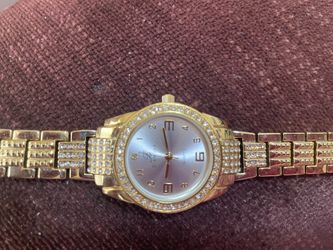 Women’s Burgie dress watch gold tone round face with CZ’s bracelet band quartz movement