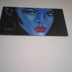 Singer Rihanna In Blue On Wood.