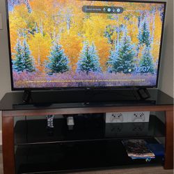 55” TCL ROKU 4K UHD Smart TV-High Dynamic Range(HDR) Comes With The TV Stand (Glass, Metal & Wood)