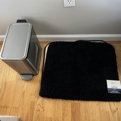 A new bath mat, like New trash can, and a used laundry basket, all for $15
