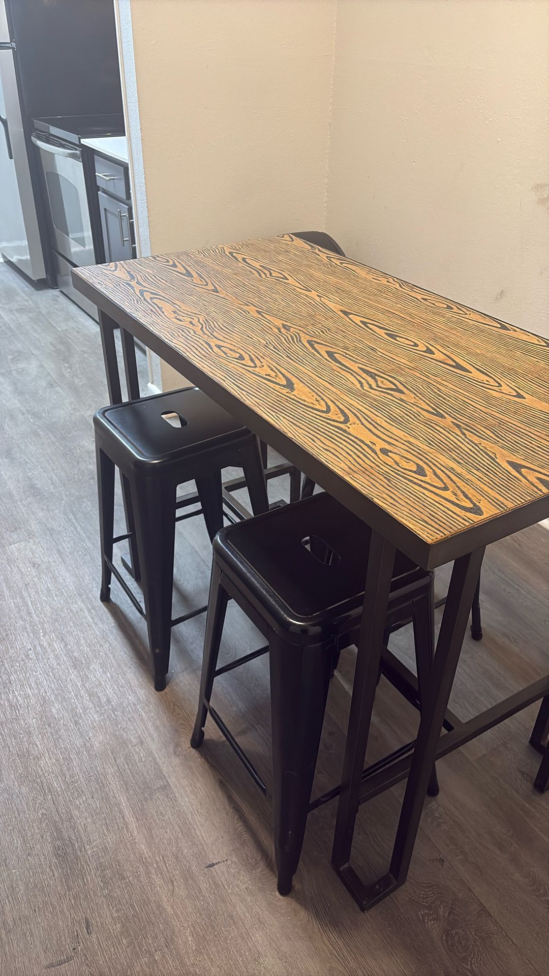 Brown Table With 4 Black Chairs