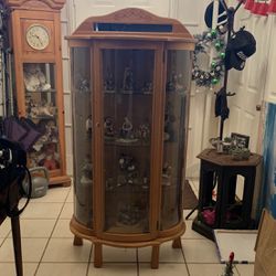 Curved Glass Curio Cabinet. Three (3) Glass Shelfs and Light. Also has lock feat