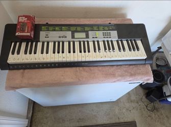 Casio LK-135 keyboard with universal power adapter