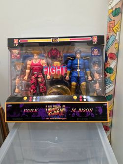 Jada Toys Street Fighter II Guile vs M. Bison, 2-Pack Action Figure, 1:12 Scale, 6" Tall, Interchangeable Heads, Hands & Accessories