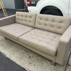 IKEA LANDSKRONA or MORABO 2-seat sofa, typically featuring tufted leather seating and chrome-plated steel legs