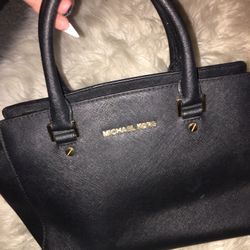 Small authentic black and gold metal Michael Kors bag