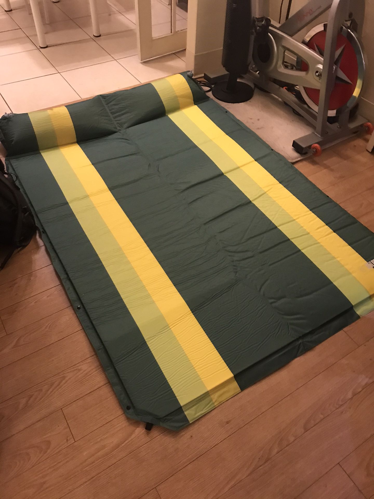 Folding self inflating camping sleeping pad