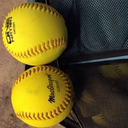 25 ALMOST MINT CONDITION SOFT BALLS.