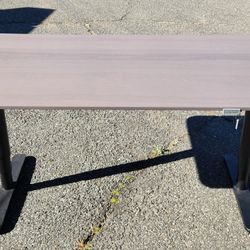 2-drawer locking grey woodgrain lateral file cabinet with adjustable bars and matching motorized hight adjustable grey woodgrain desk.