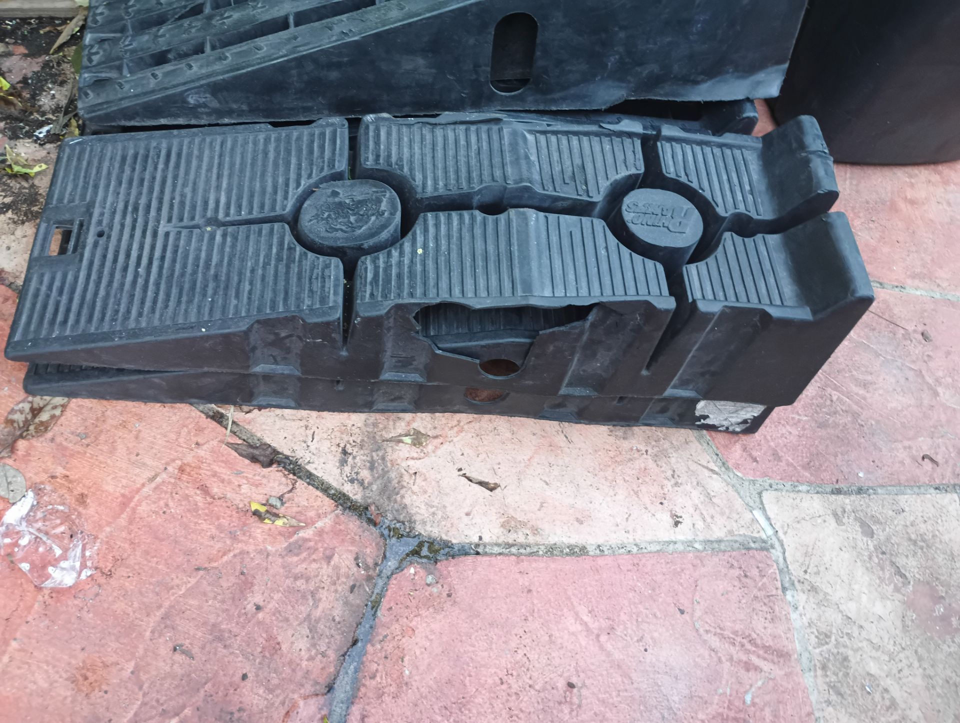 RhinoGear RhinoRamps, constructed from a durable polymer resin designed for vehicle maintenance. Weight Capacity: They typically support a gross vehic