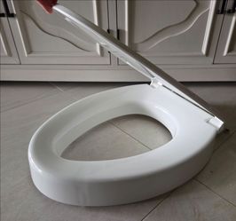 3 Inch Elevated Elongated  Toilet Seat. Sanitized and Like New