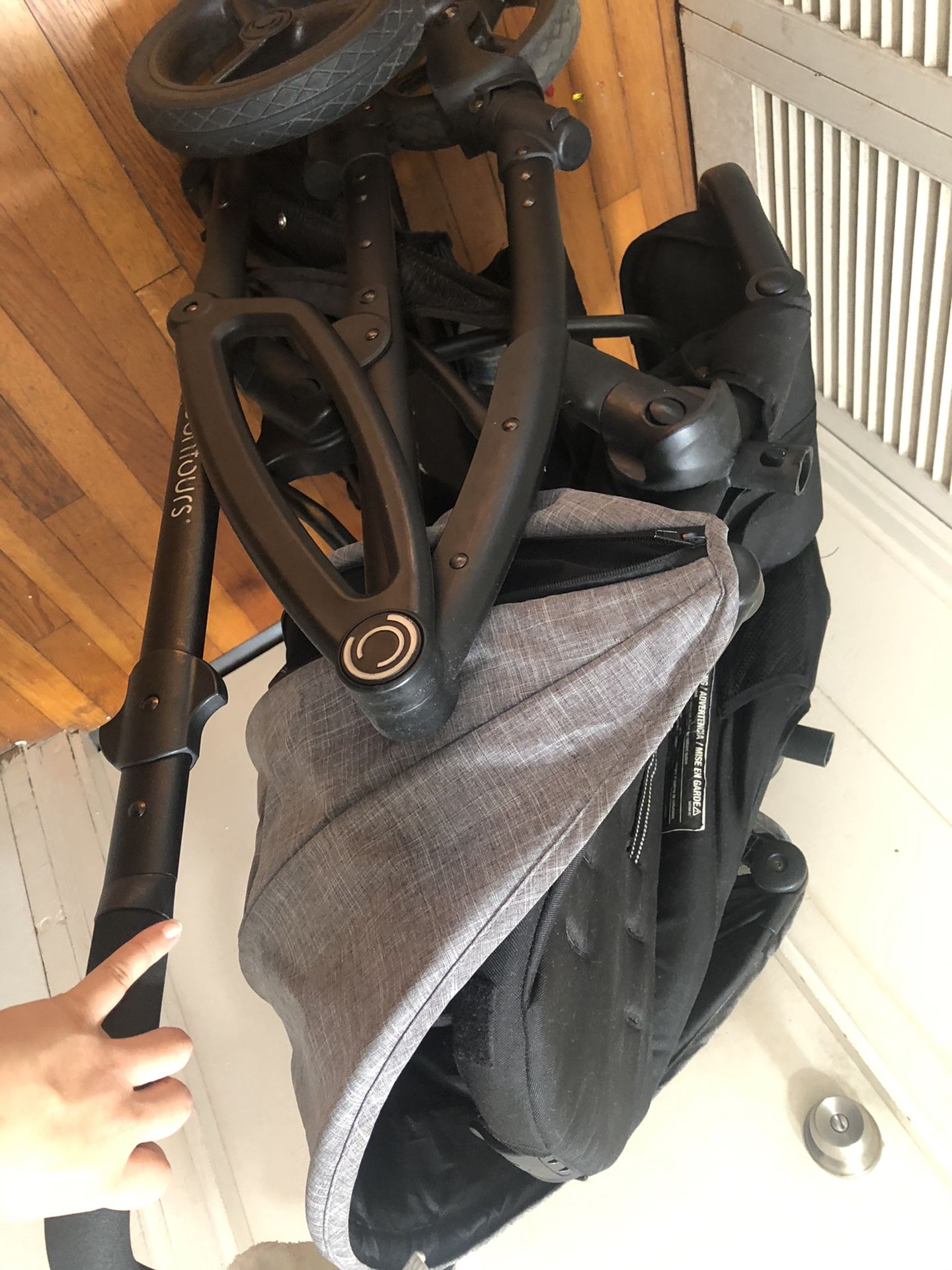 Double stroller with car seat attachment