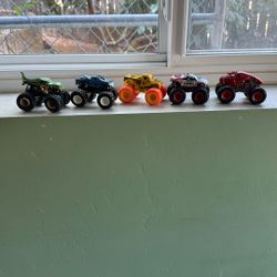 5 Used Hot Wheels Monster Trucks Dinosaur Captain American Cars