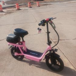 Pink Electric Scooter New comes with 6 keys..25 mph 40 mile range.all u do is charge it..obo