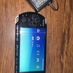 Sony PSP-3000 Handheld System Black Includes Charger, Battery, And One Game