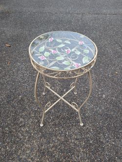 Intricate glass plant stand