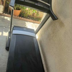 The image shows a NordicTrack T17.2 treadmill, identifiable by the "C1550" and "QUADFLEX CUSHIONING" markings on the side, which are features associat
