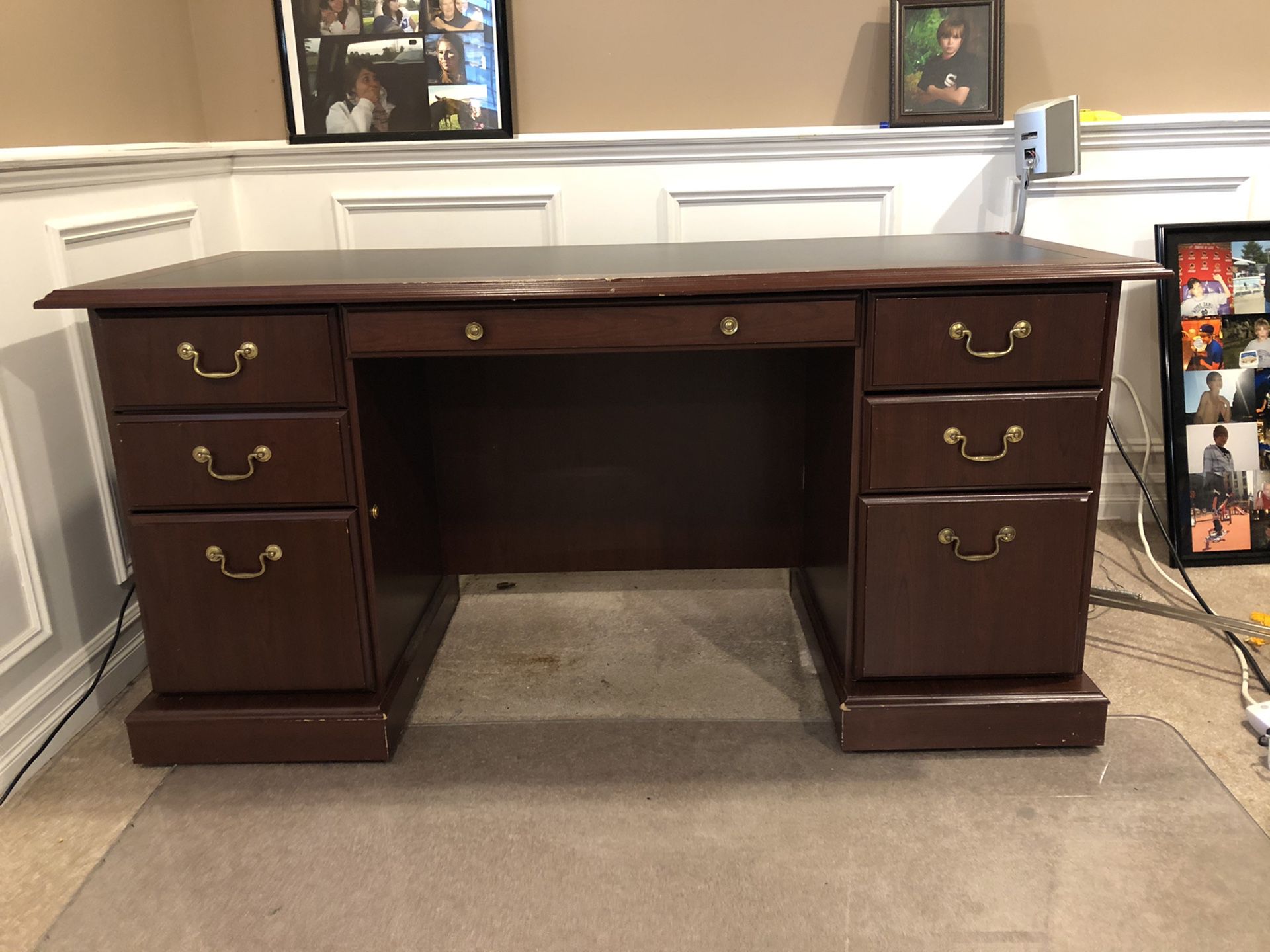 Big desk with one locking file cabinet.
