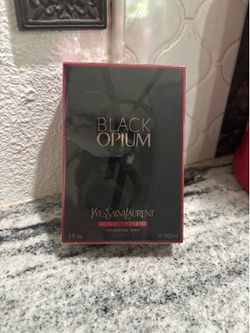 YSL Black Opium eau de parfum over red