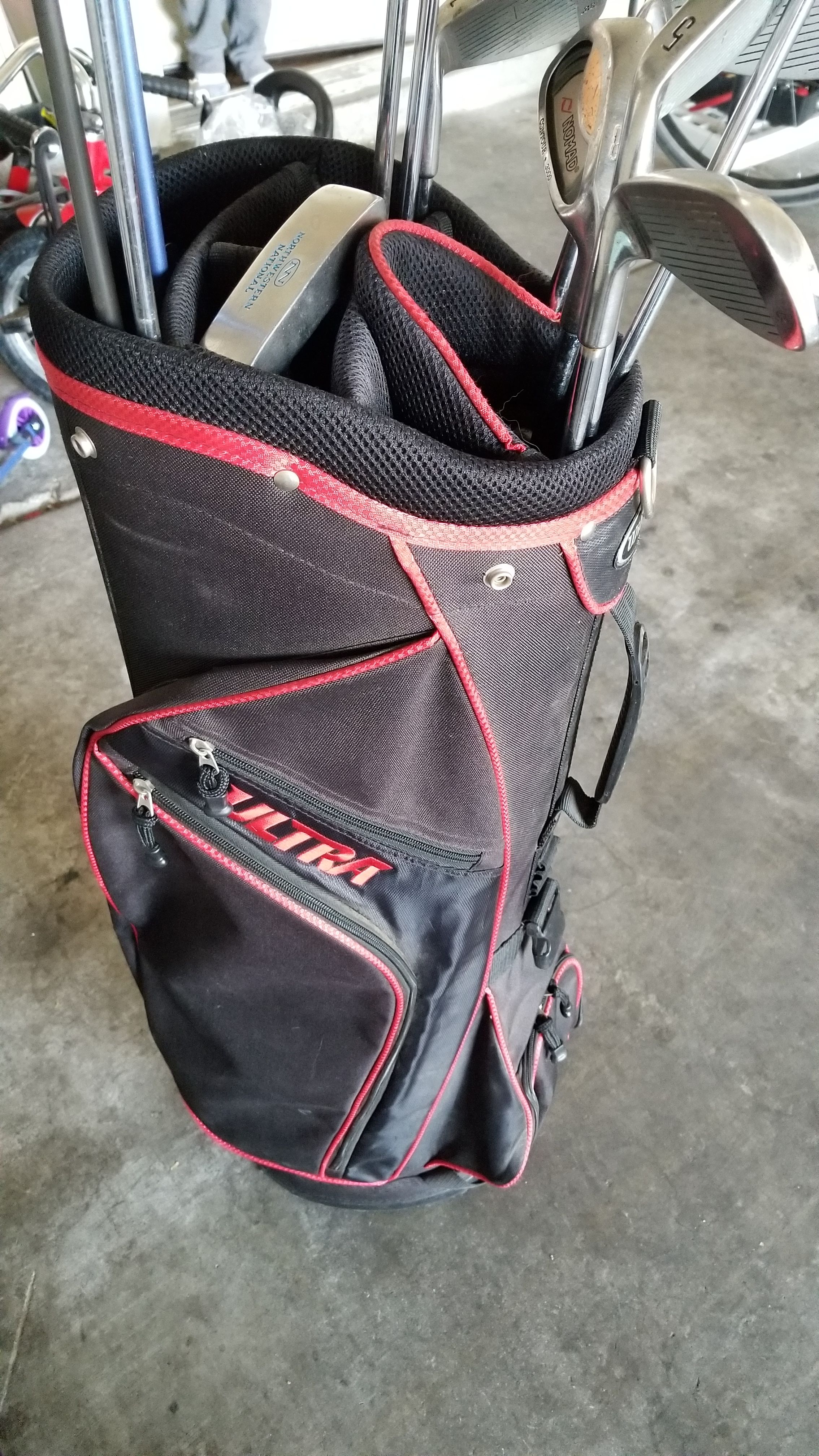 Nomad golf clubs and wilson bag