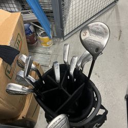 11 Assorted Golf Clubs and Bag
