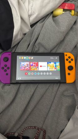 Nintendo handheld gaming device multicolor handles great condition