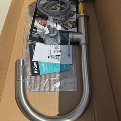 Llave de fregadero nueva en su caja