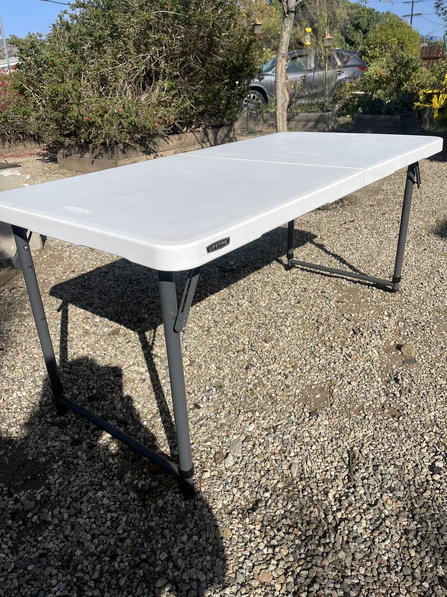 Lifetime 4 Ft. One Hand Adjustable Heigth-in Half Resin Table