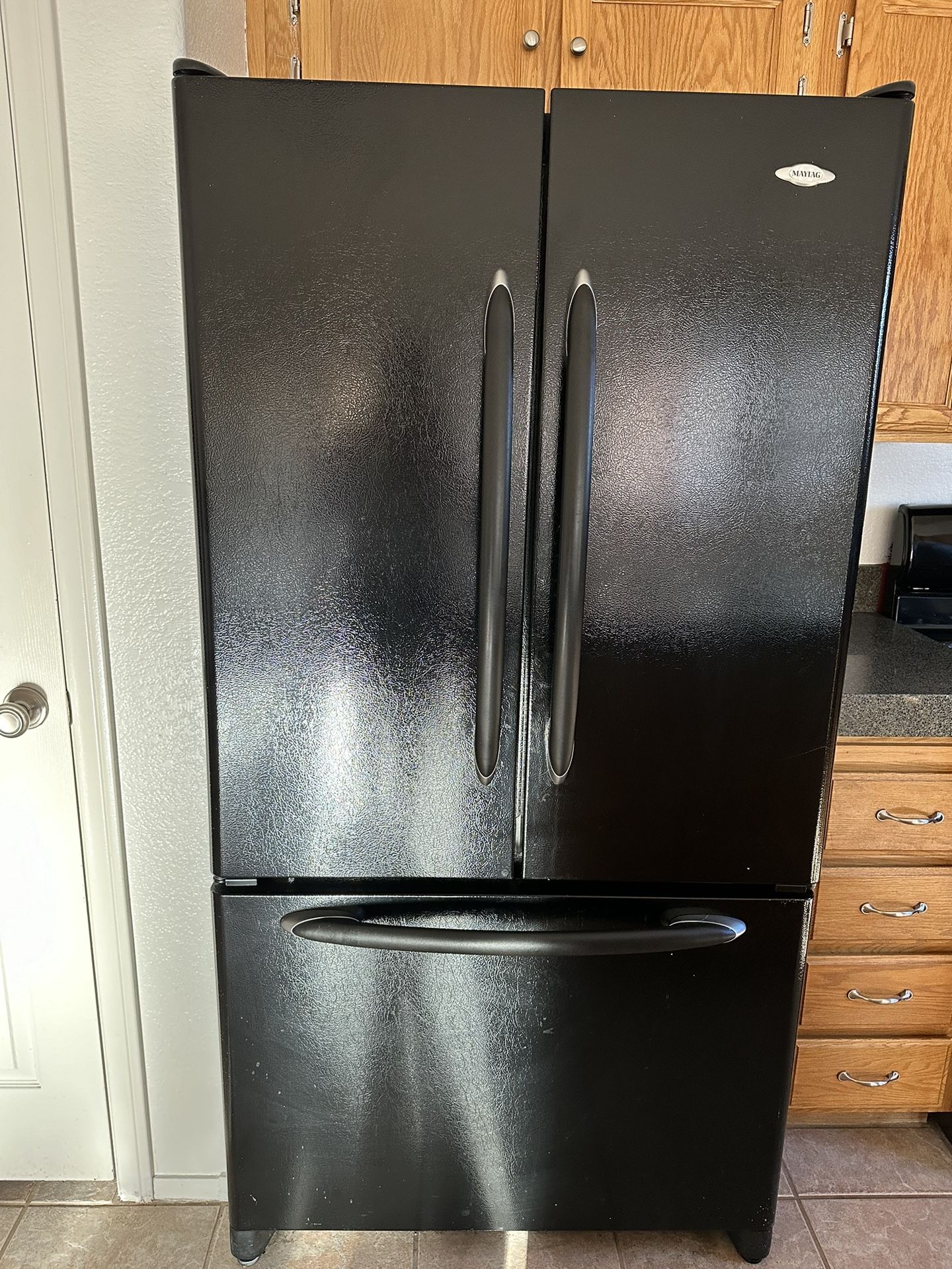 Black Maytag Refrigerator and Stove 