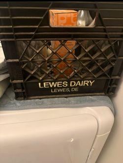 “Vintage LEWES DAIRY milk crate from Lewes Delaware. Black crate with gold lettering. Excellent condition for its age. Great for farmhouse décor, stor