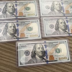 One Hundred dollar bills with a star