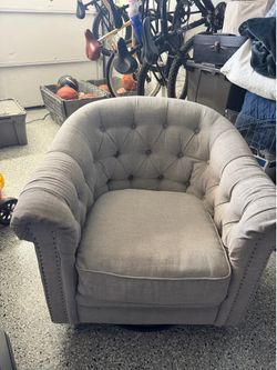 Gray linen swivel rocking chair