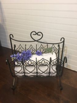 Wrought iron rack.., as is... one side has lifted