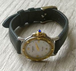 Woman’s Solid 18k Gold & Stainless + Diamonds Swiss Watch